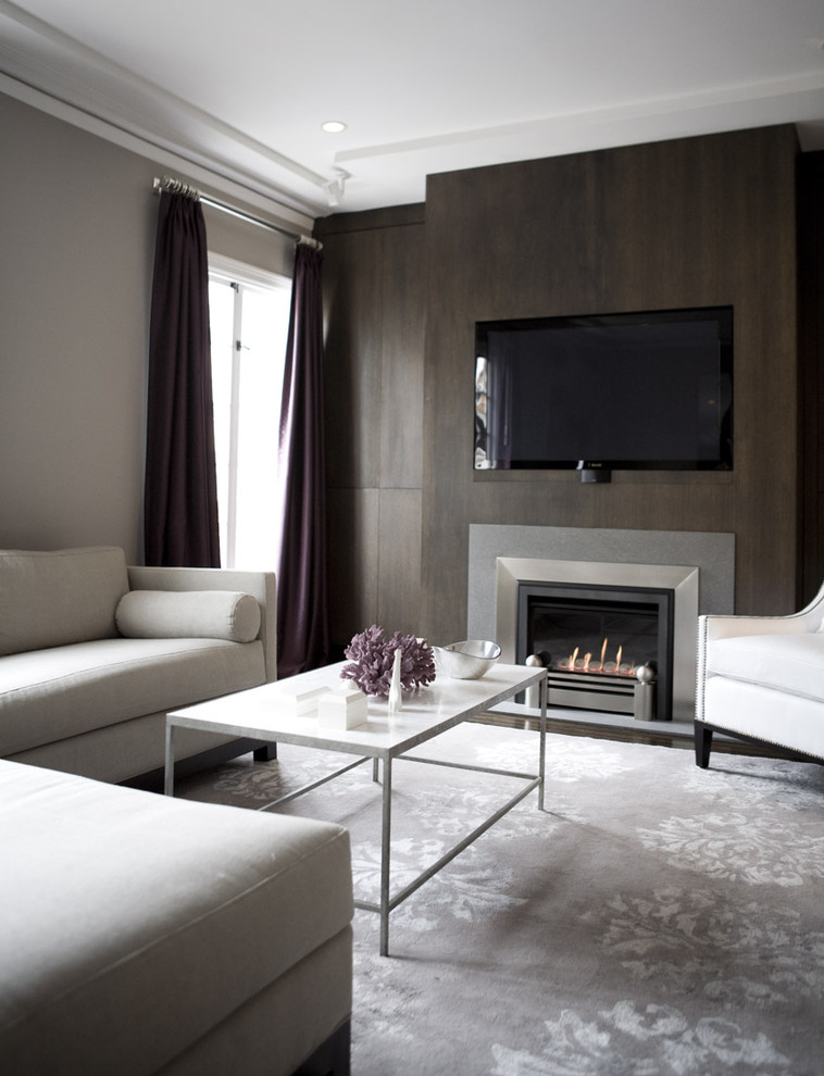 Contemporary living room feature wall in San Francisco with grey walls and a standard fireplace.