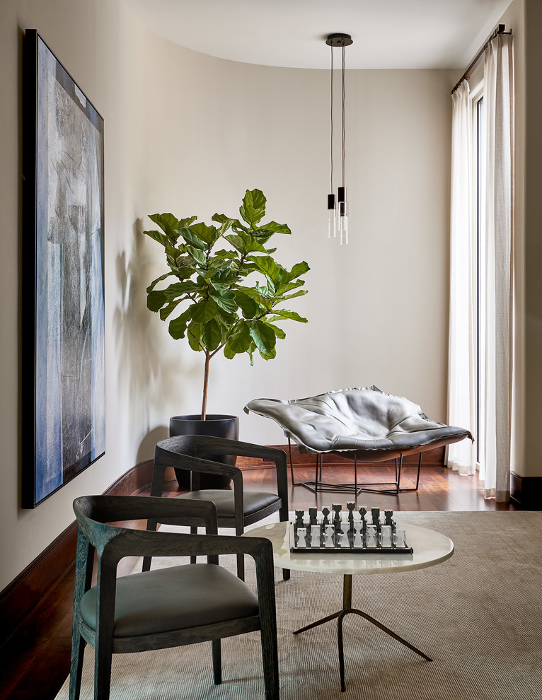 На фото: изолированная гостиная комната среднего размера в современном стиле с серыми стенами и темным паркетным полом без камина, телевизора с