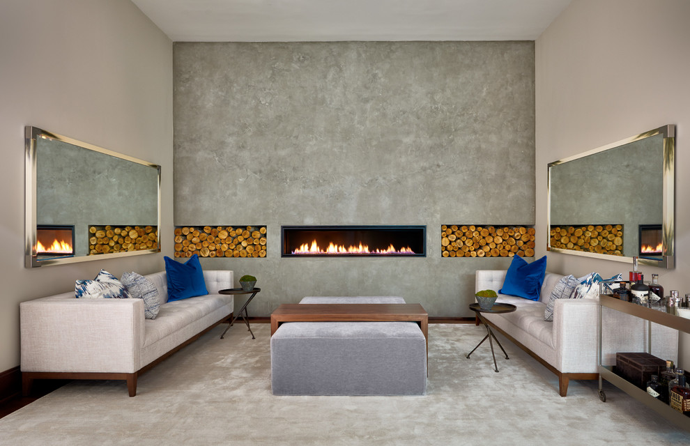 На фото: изолированная гостиная комната среднего размера в современном стиле с домашним баром, серыми стенами, темным паркетным полом, горизонтальным камином, фасадом камина из бетона и ковром на полу без телевизора