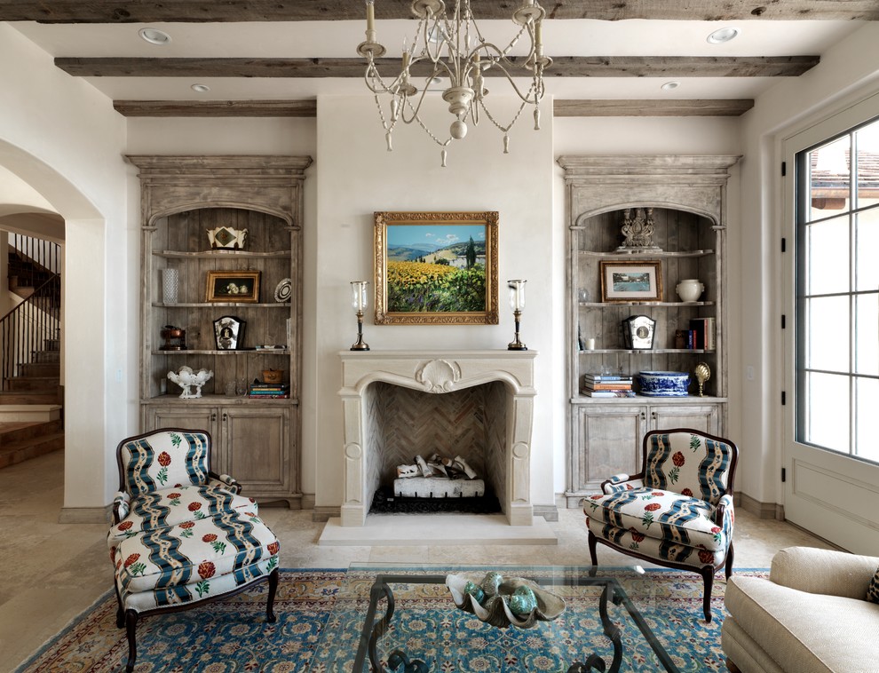 Inspiration for a mediterranean enclosed living room remodel in San Francisco with white walls and a standard fireplace