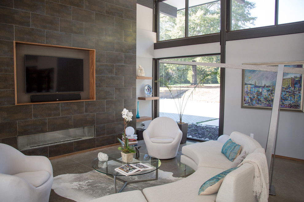 Mid-sized minimalist formal and open concept concrete floor and gray floor living room photo in Richmond with white walls, a ribbon fireplace, a tile fireplace and a wall-mounted tv