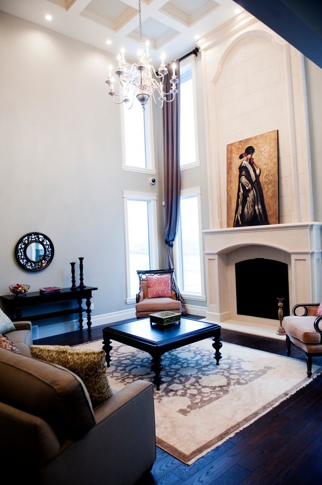 Пример оригинального дизайна: парадная, изолированная гостиная комната среднего размера в викторианском стиле с белыми стенами, темным паркетным полом, стандартным камином, фасадом камина из бетона и коричневым полом без телевизора