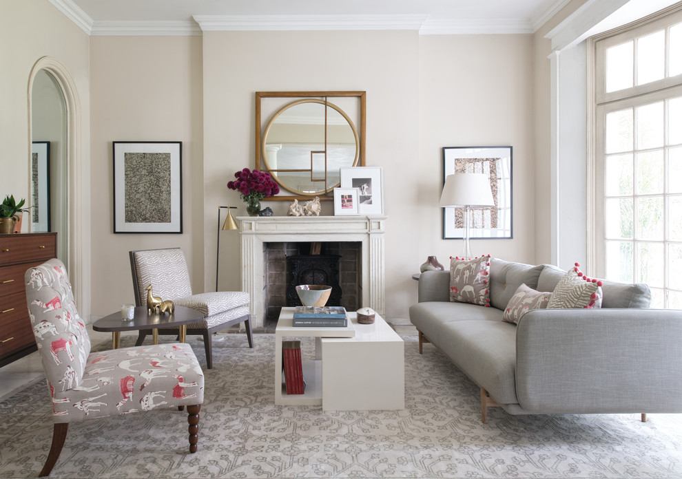 Design ideas for a traditional formal living room in London with beige walls, a standard fireplace and no tv.