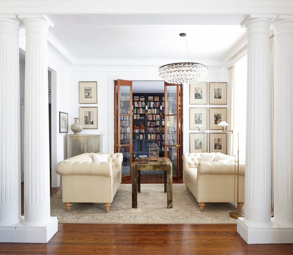 Inspiration for a small eclectic enclosed dark wood floor living room remodel in New York with white walls and no tv