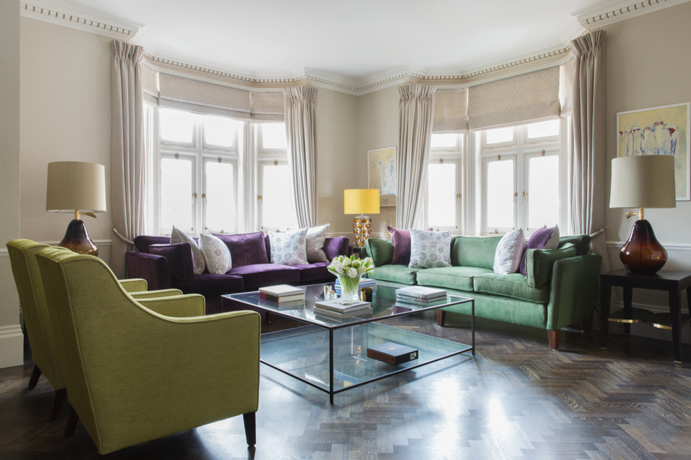 This is an example of a large classic living room in London with beige walls, dark hardwood flooring and brown floors.