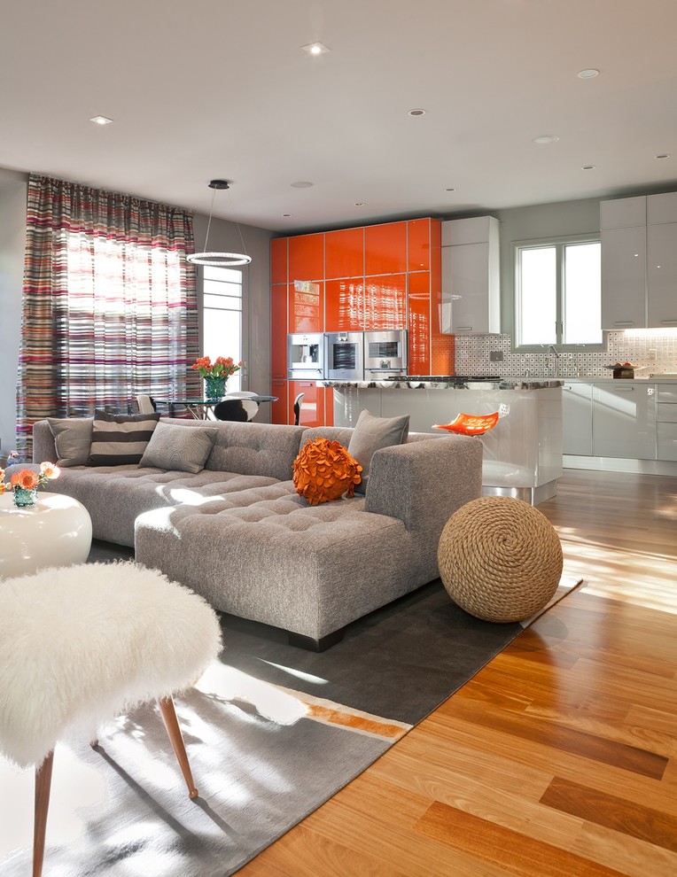 Trendy formal and open concept medium tone wood floor living room photo in San Francisco with gray walls