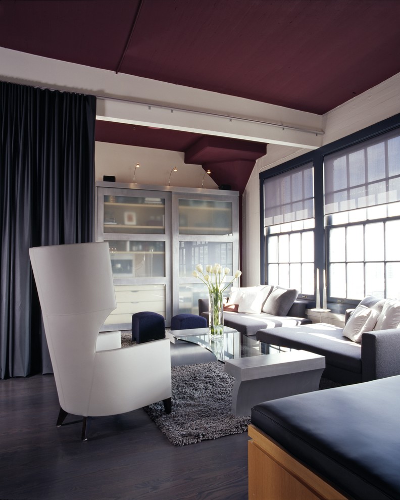 Inspiration for a contemporary grey and black living room in San Francisco with white walls and dark hardwood flooring.
