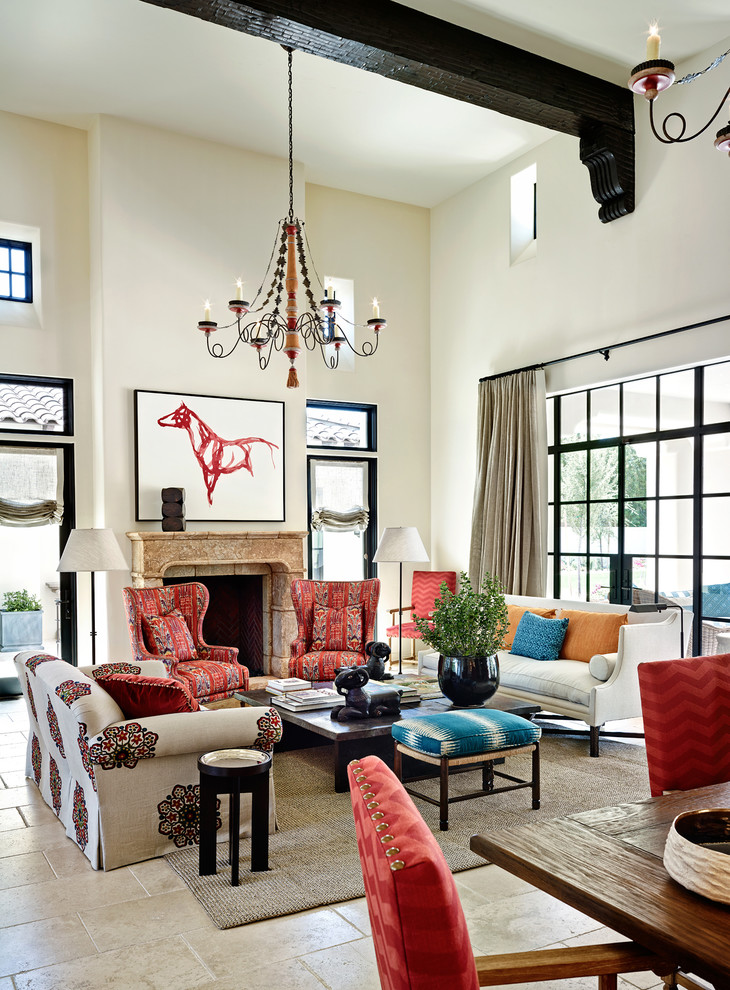 Living room - large mediterranean open concept living room idea in Phoenix with white walls, a standard fireplace, a stone fireplace and no tv