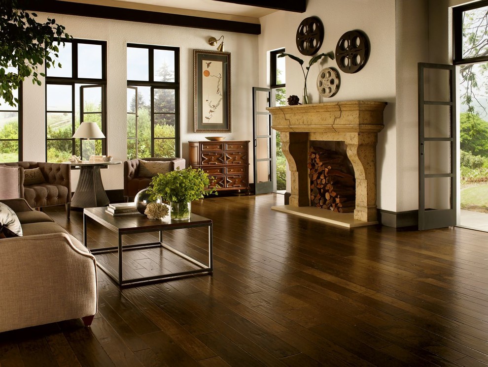 Medium sized rustic formal open plan living room in Chicago with beige walls, dark hardwood flooring, a standard fireplace, a stone fireplace surround and no tv.
