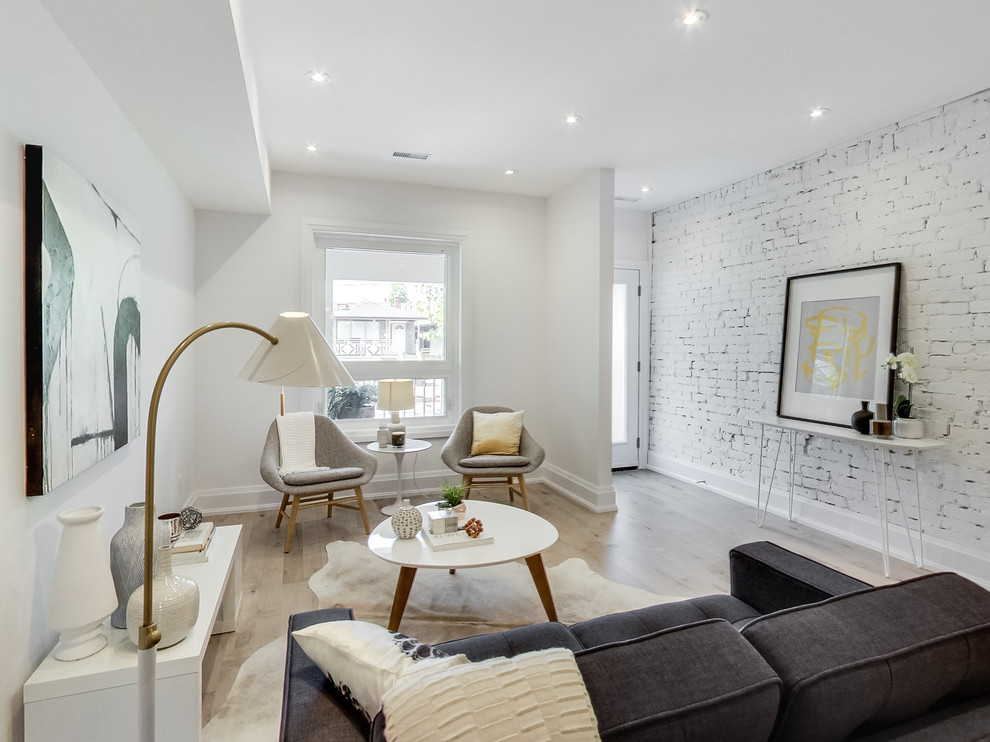 Medium sized scandinavian formal open plan living room in Toronto with white walls, light hardwood flooring, no fireplace and no tv.