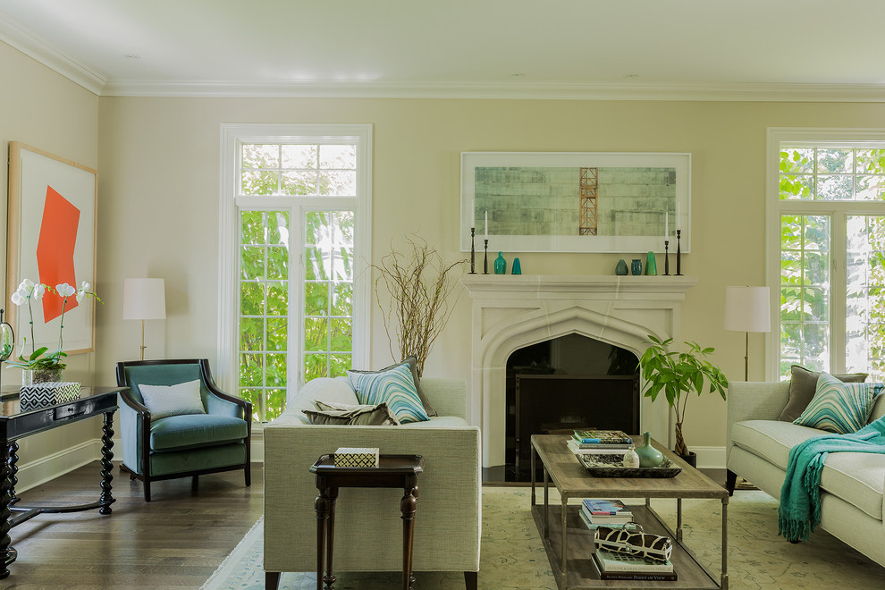 Living room - mid-sized transitional formal medium tone wood floor and brown floor living room idea in Boston with beige walls, a standard fireplace and a stone fireplace