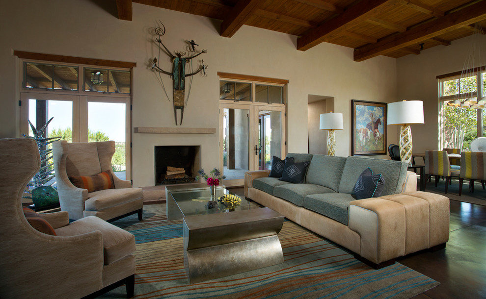 Formal open plan living room in Albuquerque with beige walls, a standard fireplace, no tv and feature lighting.