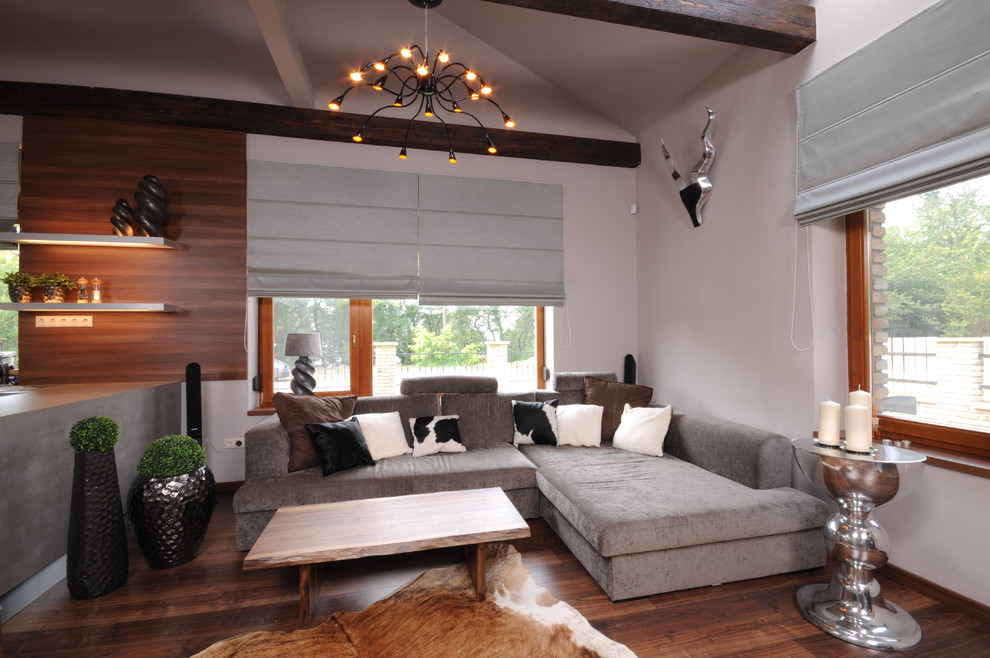 Example of a trendy dark wood floor living room design with white walls