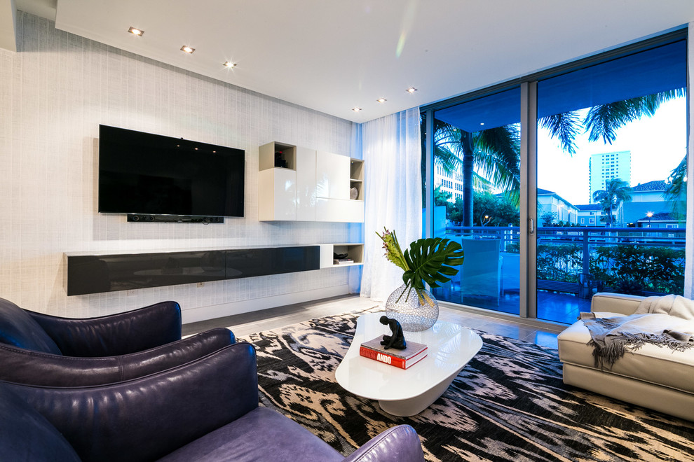 Photo of a large modern open plan living room in Miami with ceramic flooring and a wall mounted tv.