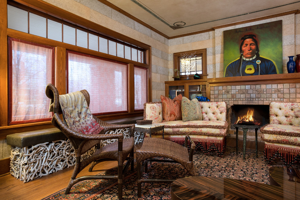 Medium sized traditional formal enclosed living room in Seattle with beige walls, medium hardwood flooring, a standard fireplace, a tiled fireplace surround, no tv and brown floors.
