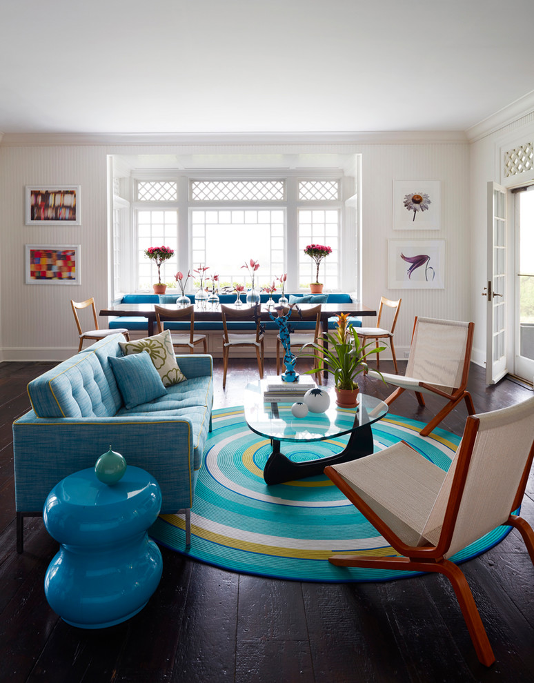 Example of an eclectic dark wood floor and brown floor living room design in New York with white walls