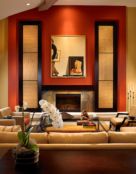 Свежая идея для дизайна: большая открытая, парадная гостиная комната в восточном стиле с оранжевыми стенами, стандартным камином, фасадом камина из камня и полом из известняка без телевизора - отличное фото интерьера