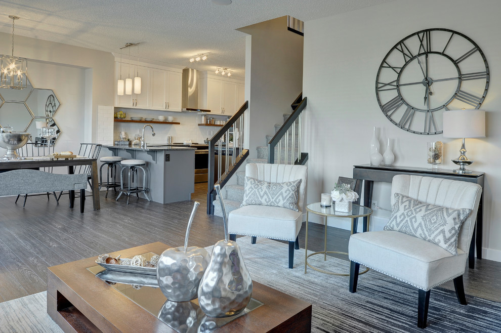 Photo of a medium sized traditional formal open plan living room in Edmonton with grey walls, vinyl flooring, a hanging fireplace, a tiled fireplace surround, a wall mounted tv and black floors.