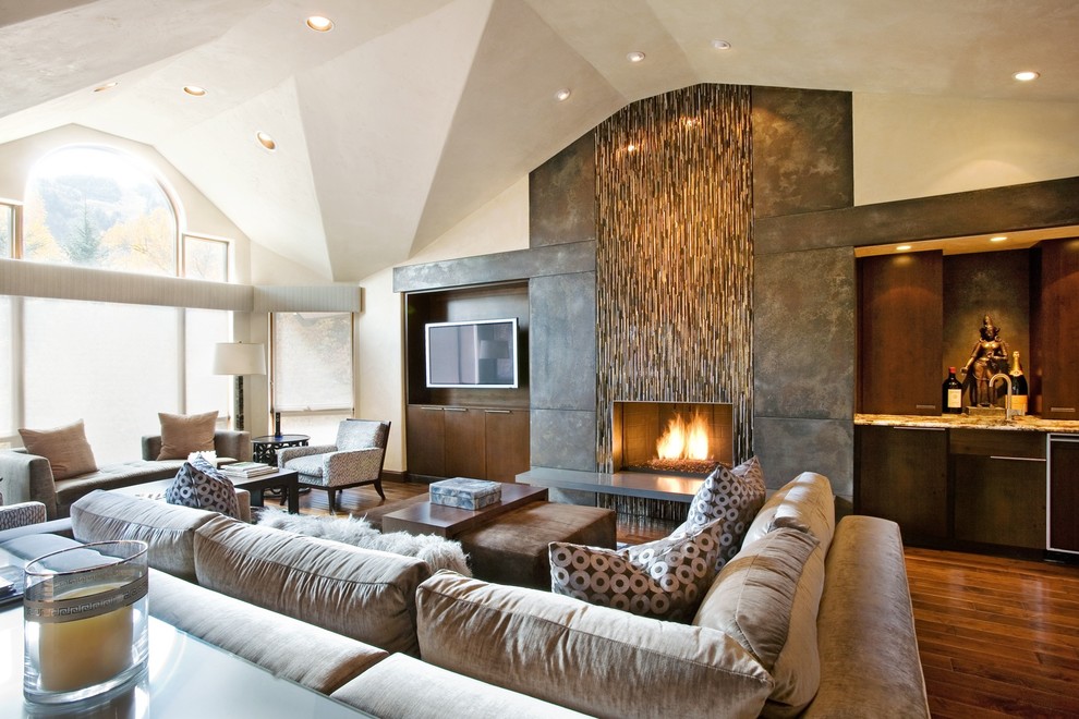 Example of a huge trendy living room design in Denver with a standard fireplace
