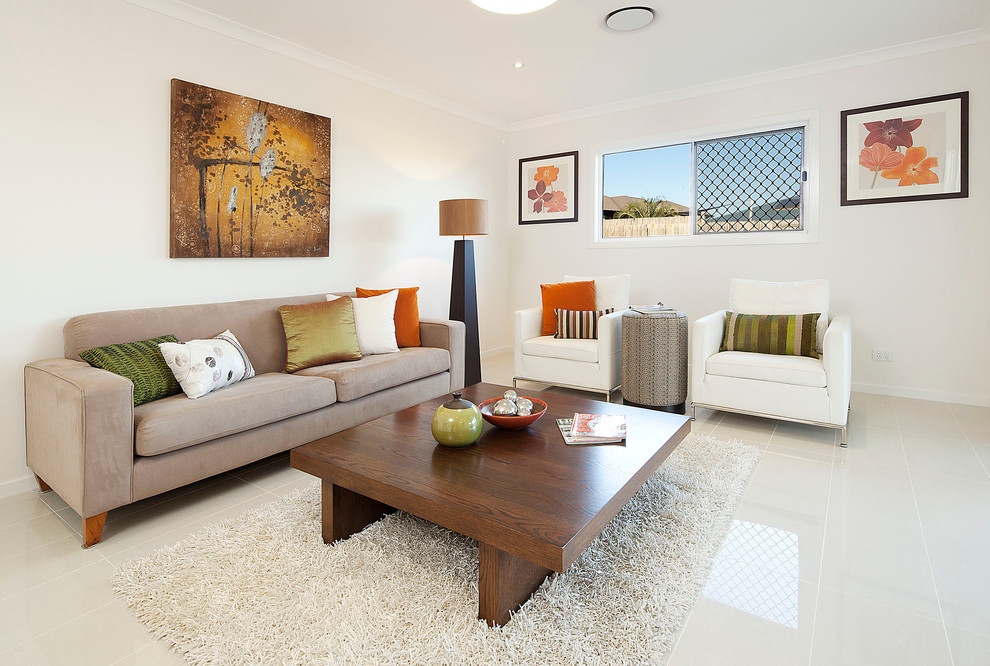 Example of a transitional living room design in Brisbane