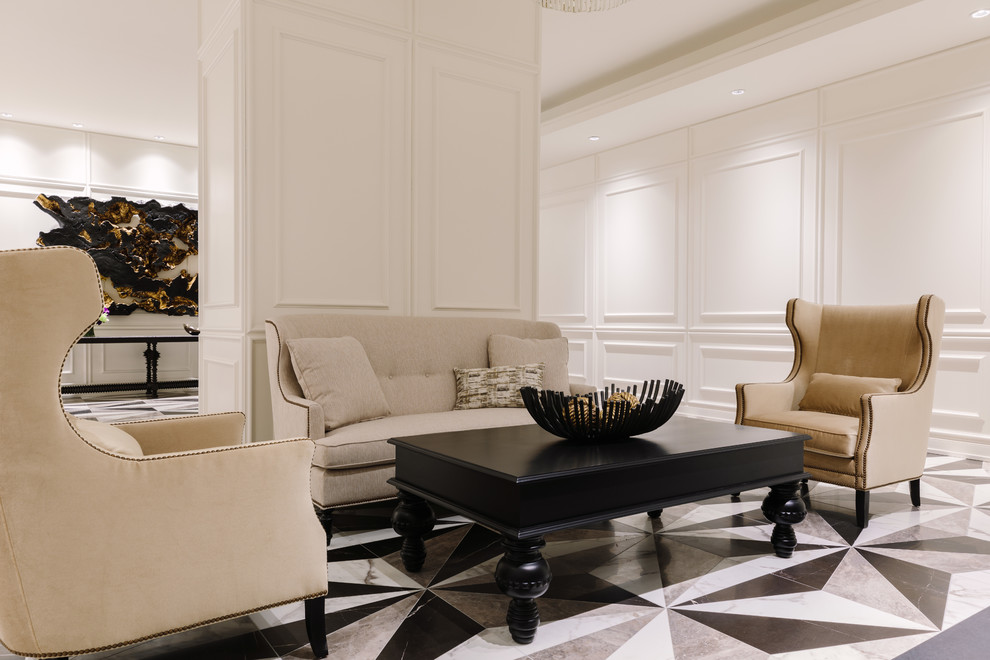 На фото: большая парадная, открытая гостиная комната в стиле неоклассика (современная классика) с белыми стенами, стандартным камином, фасадом камина из металла и разноцветным полом без телевизора