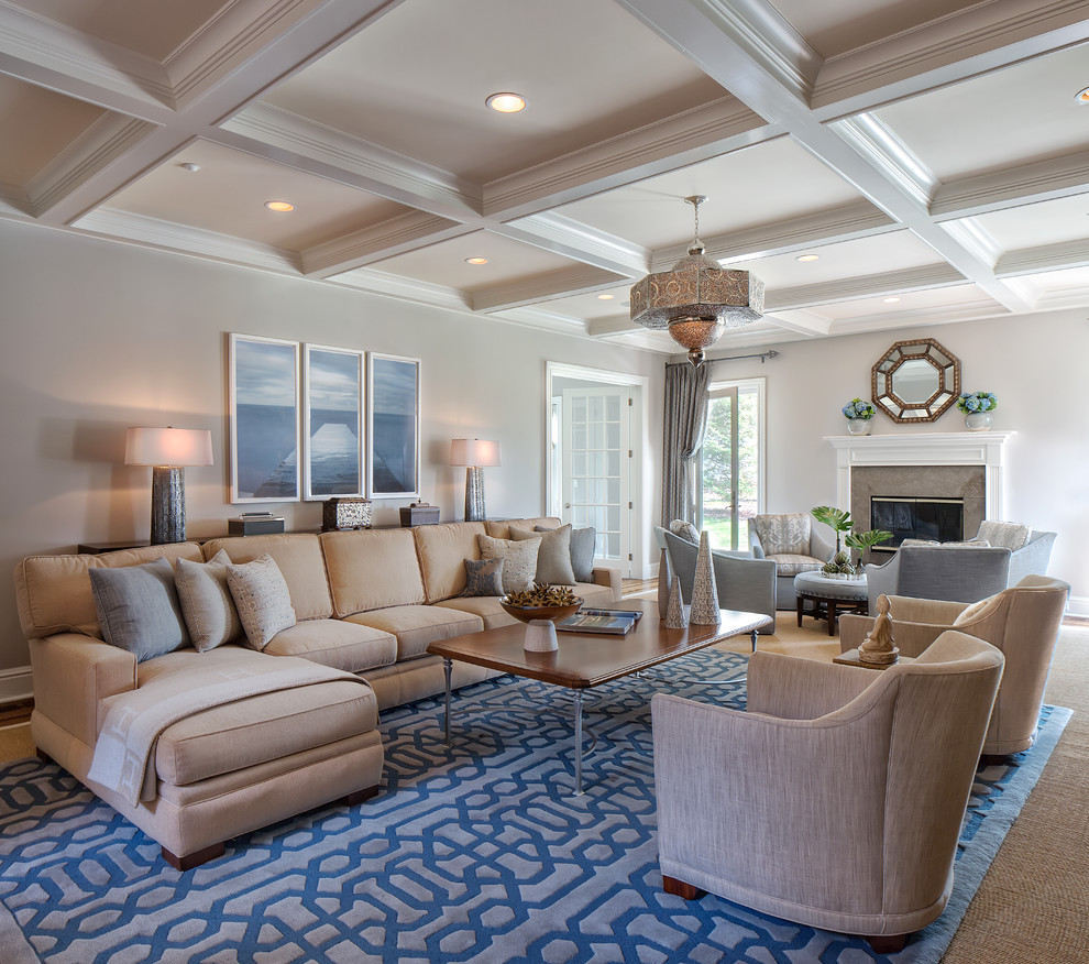 Large classic formal open plan living room in Other with a standard fireplace, beige walls, a stone fireplace surround, no tv and feature lighting.