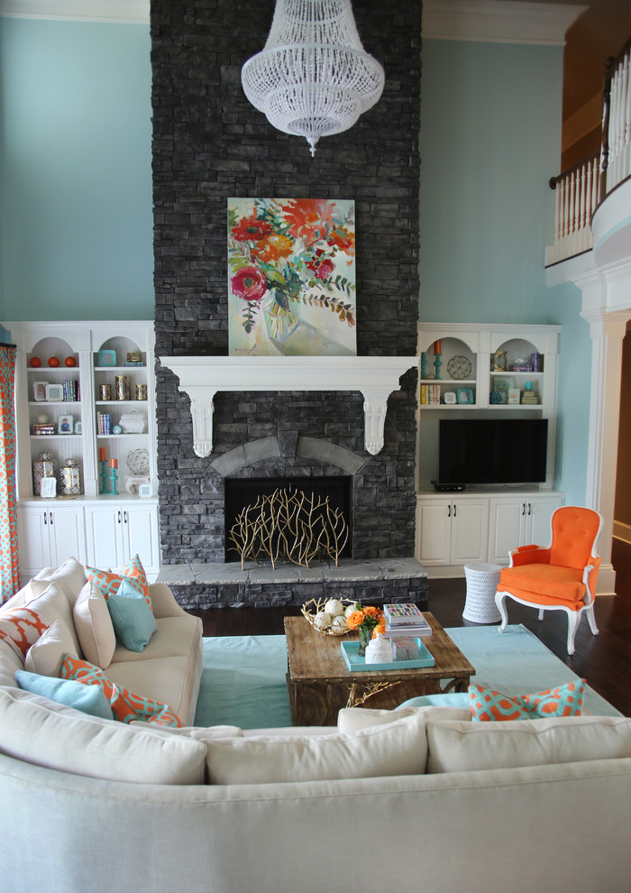 Inspiration for a transitional formal dark wood floor living room remodel in Atlanta with blue walls, a standard fireplace, a stone fireplace and a tv stand