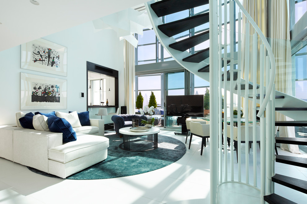 Свежая идея для дизайна: гостиная комната в современном стиле с белыми стенами и полом из керамогранита - отличное фото интерьера