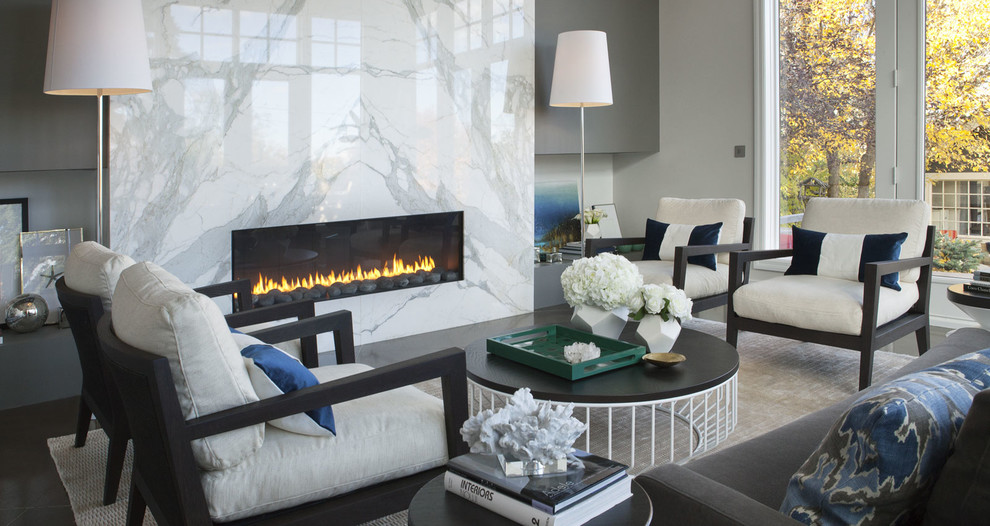 Inspiration for a mid-sized contemporary formal carpeted living room remodel in Calgary with multicolored walls, a ribbon fireplace and a stone fireplace