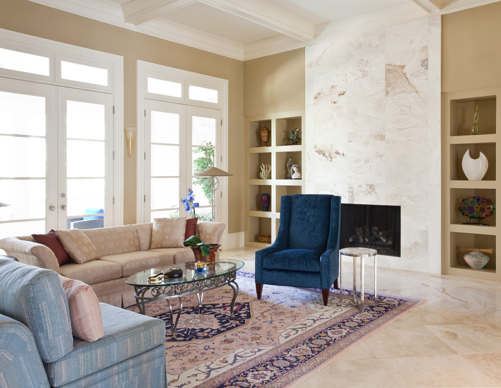 Living room - large eclectic open concept travertine floor living room idea in Atlanta with beige walls, a standard fireplace, a wood fireplace surround and a media wall