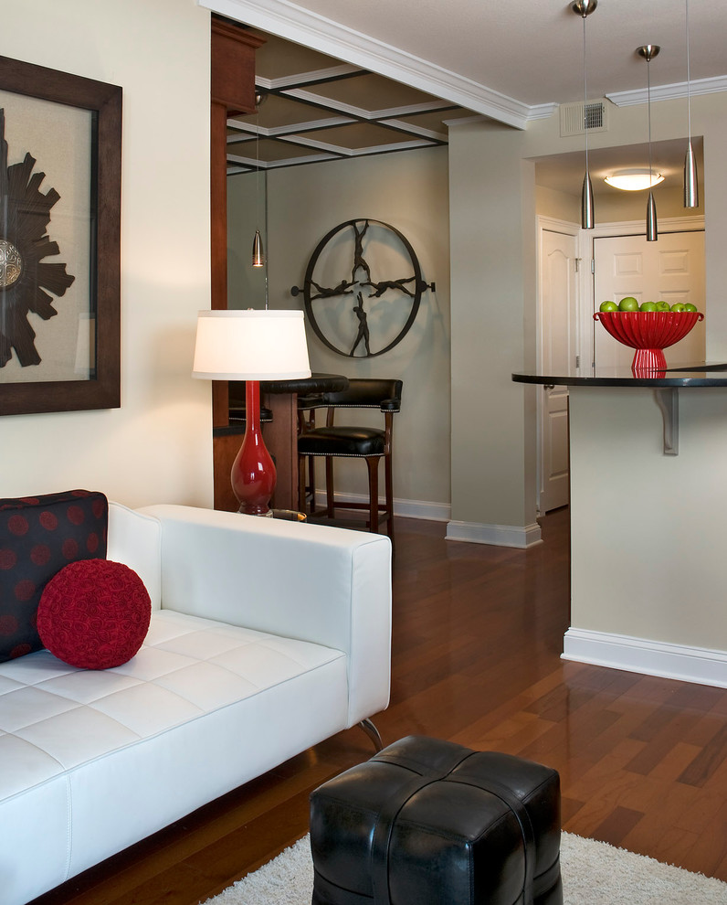 Example of a mid-sized trendy enclosed medium tone wood floor living room design in Atlanta