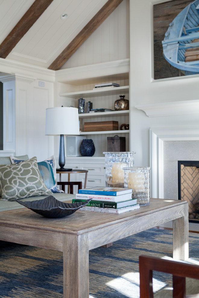 Example of a large beach style formal and open concept medium tone wood floor living room design in Boston with white walls, a standard fireplace and a stone fireplace