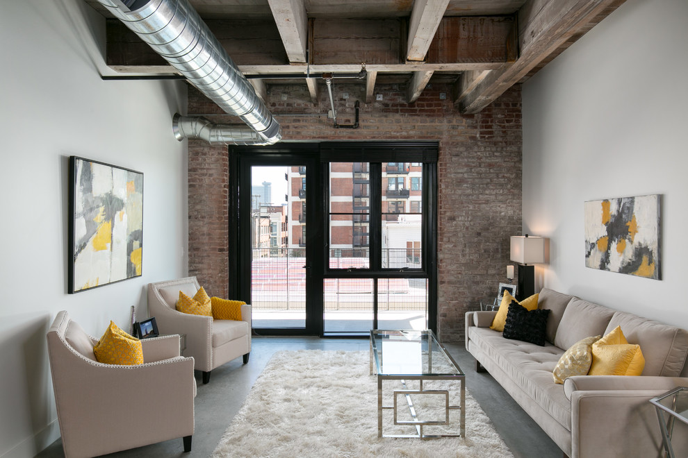 Urban mezzanine living room in Kansas City with grey walls, concrete flooring, no fireplace and grey floors.