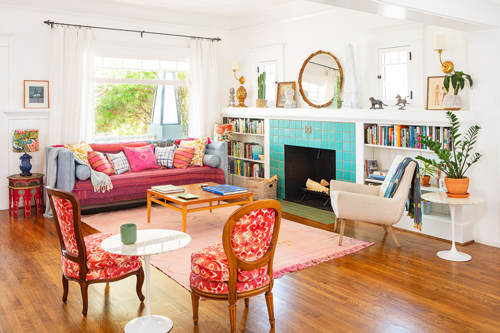Large arts and crafts open concept medium tone wood floor and brown floor living room photo in Los Angeles with white walls, a standard fireplace and a tile fireplace