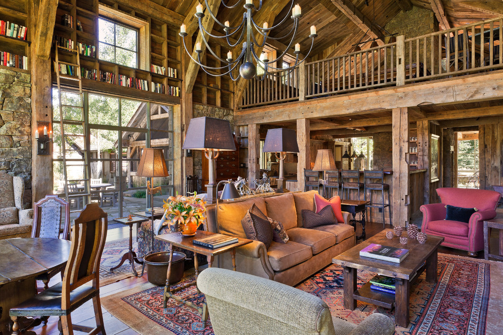 Design ideas for a rustic open plan living room in Denver with grey walls, medium hardwood flooring and brown floors.