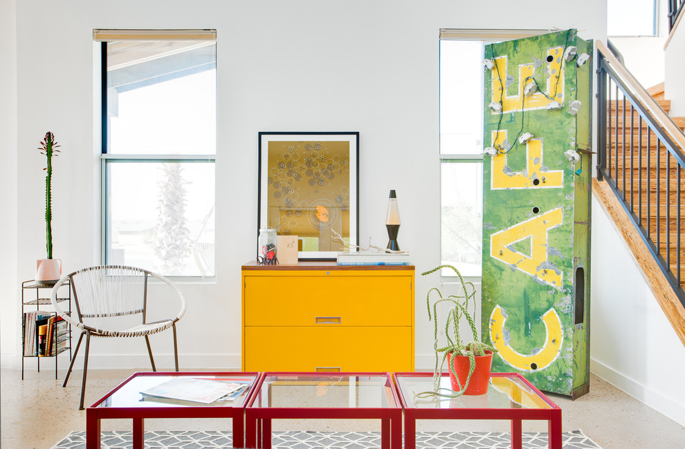 Eclectic living room photo in Austin with white walls