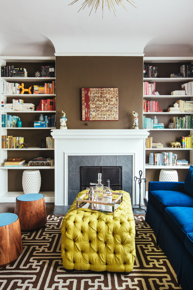 Mid-sized trendy living room library photo in San Francisco with brown walls, a standard fireplace and a stone fireplace