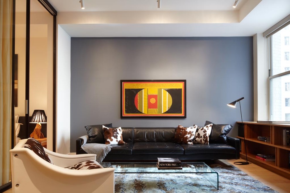 Design ideas for a contemporary enclosed living room feature wall in New York with grey walls.