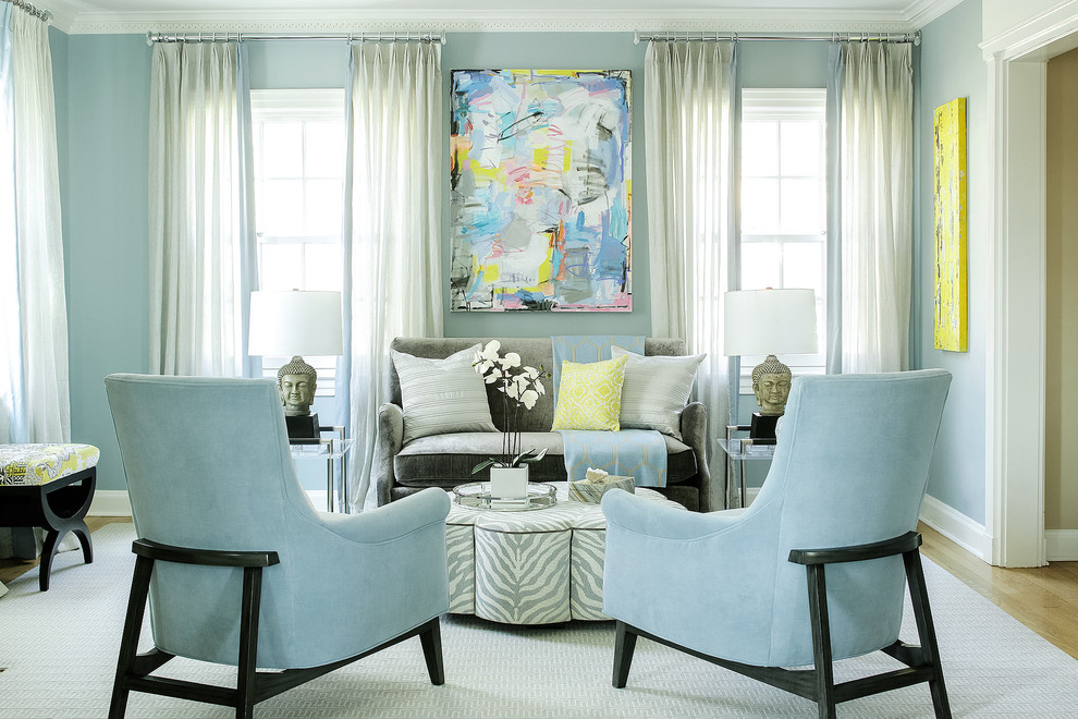 Mid-sized transitional formal and enclosed medium tone wood floor living room photo in New York with blue walls and no tv