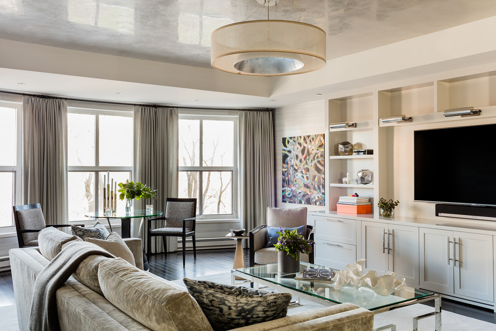 Photo of a classic open plan living room in Boston with white walls, a built-in media unit and black floors.