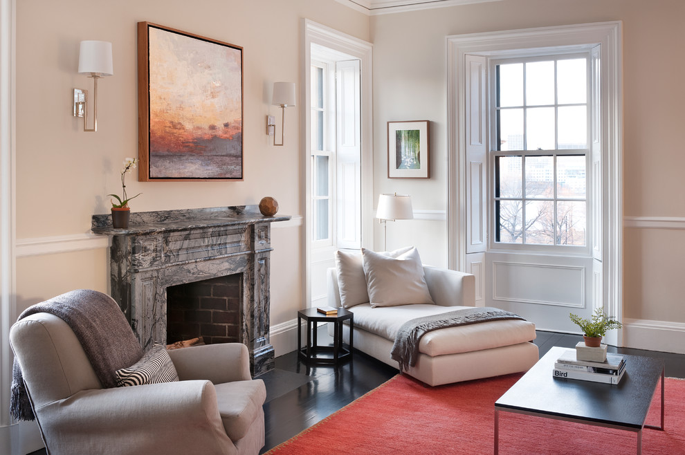 Example of a trendy living room design in Boston with beige walls, a standard fireplace and no tv