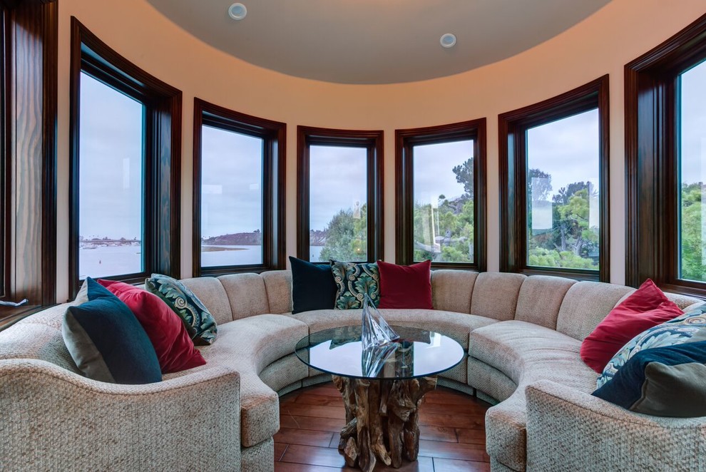 This is an example of a medium sized traditional enclosed living room in Orange County with beige walls, dark hardwood flooring, no fireplace and no tv.