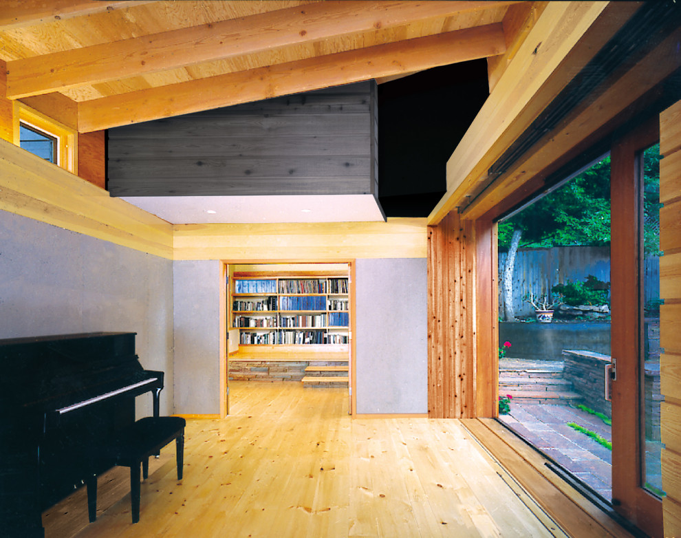 Medium sized contemporary formal enclosed living room in Denver with grey walls, light hardwood flooring and no tv.