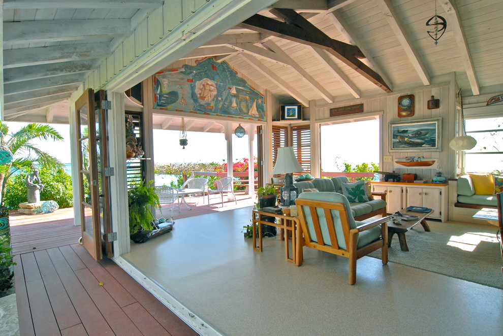 Island style open concept living room photo in Denver