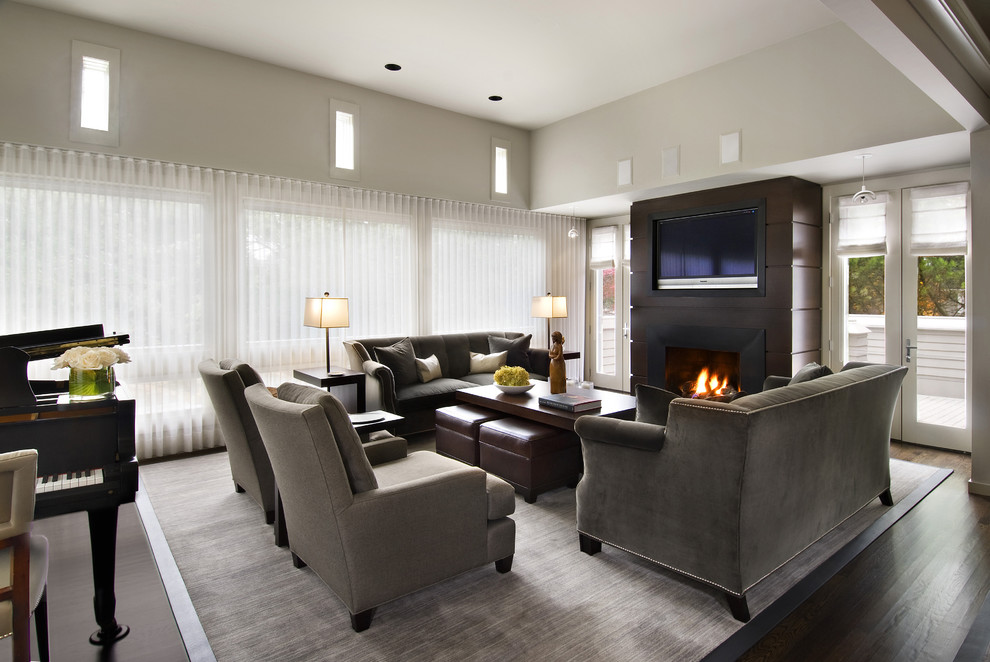 Living room - mid-sized contemporary open concept dark wood floor living room idea in Detroit with a music area, beige walls, a standard fireplace, a tile fireplace and a wall-mounted tv