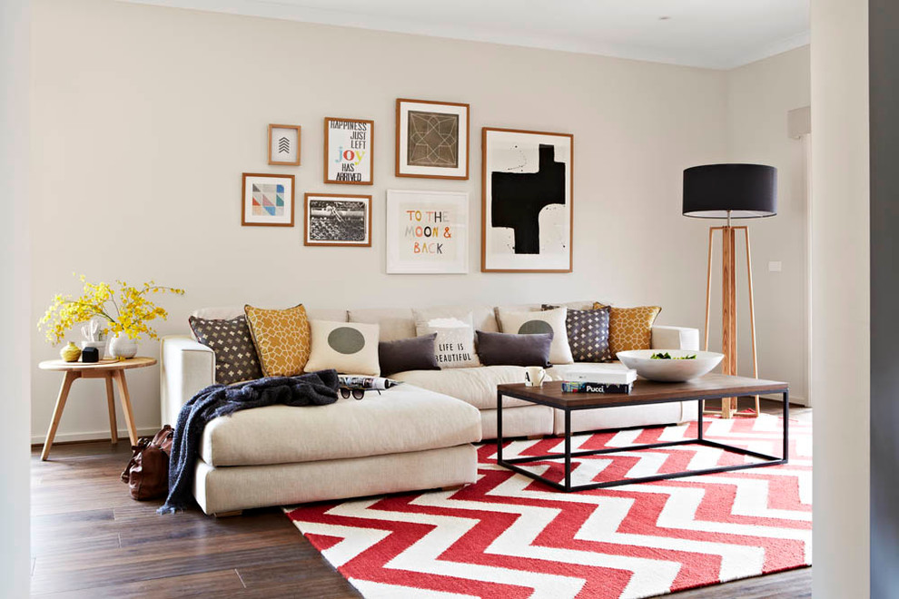Living room - contemporary formal medium tone wood floor living room idea in Melbourne with beige walls