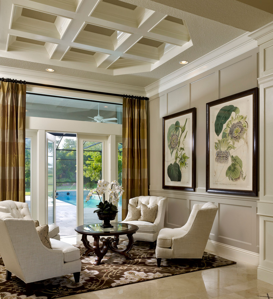 Imagen de salón para visitas clásico con paredes grises y alfombra