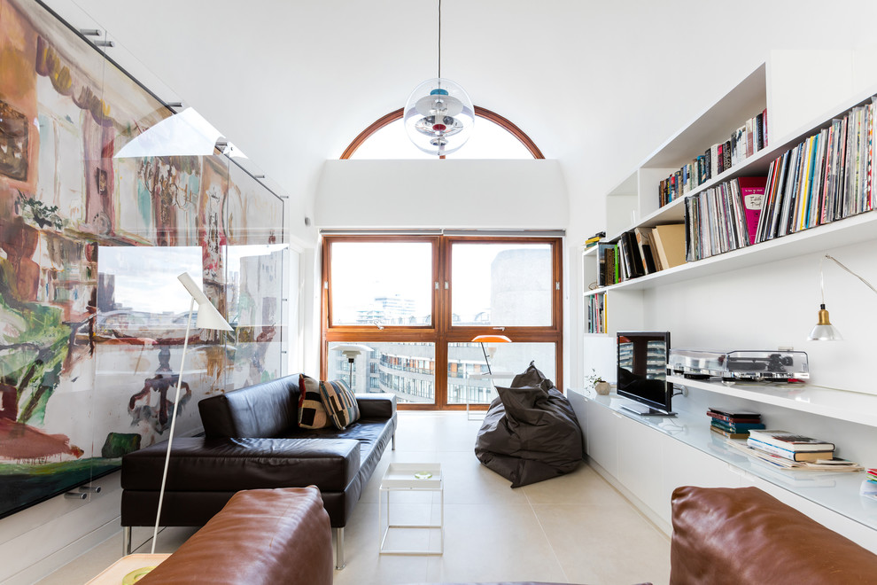 Photo of a medium sized contemporary formal enclosed living room in London with white walls, a freestanding tv and vinyl flooring.