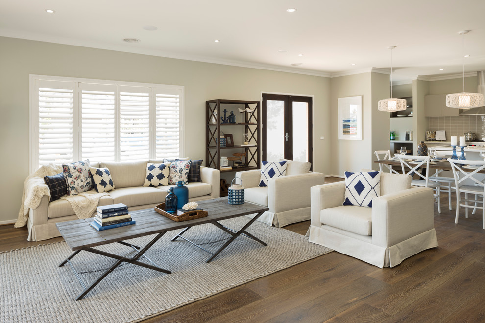 Example of a mid-sized beach style open concept living room design in Melbourne