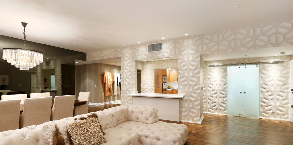 Modern formal open plan living room in Los Angeles with beige walls, dark hardwood flooring and no tv.